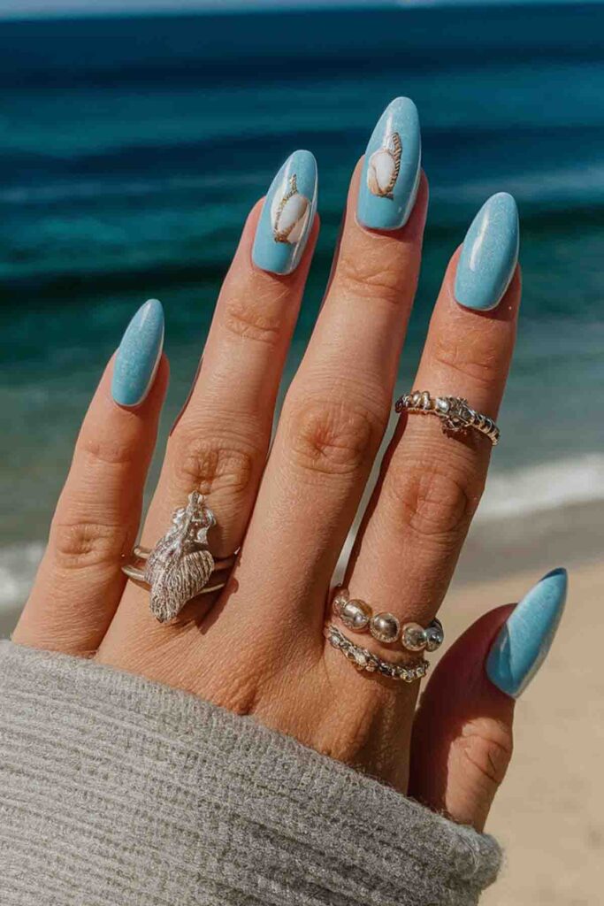 Aqua Blue with Seashell Designs Nails